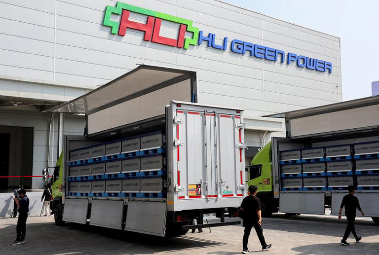 Trucks loaded with battery modules at HLI Green Power's facility in Indonesia.