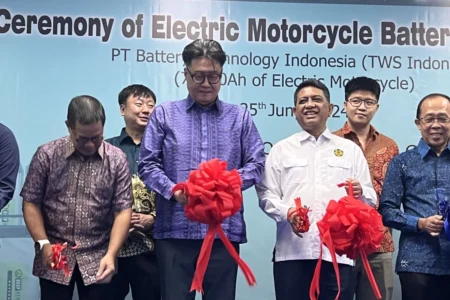 Indonesian officials inaugurating a new EV battery factory aimed at motorcycle conversions.