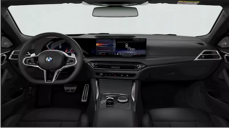Interior view of the BMW 4 Series Convertible's dashboard and steering wheel.