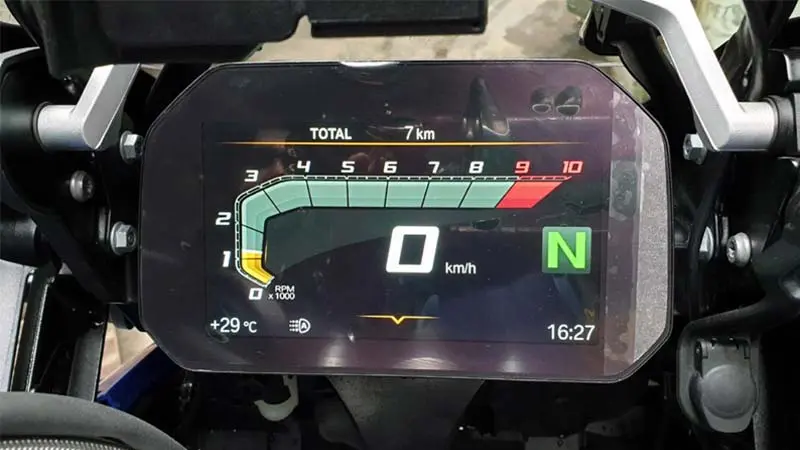A digital dashboard of BMW-R-1250-GS motorcycle showing the speedometer, odometer, RPM, temperature, and time.