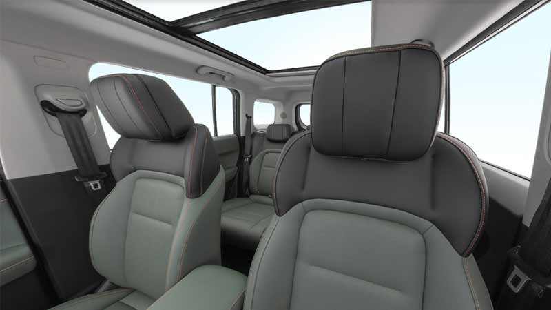 Interior of a iCAR-03 with gray leather seats and red stitching.