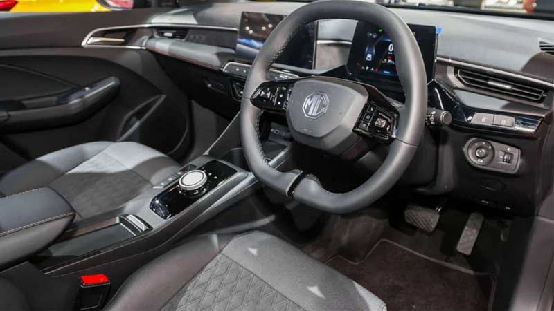 Side view of the MG3 interior featuring the steering wheel, dashboard, and central console.