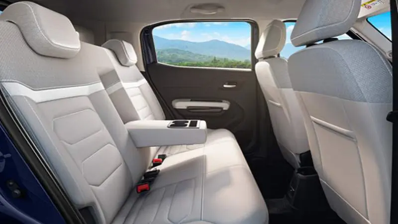 Interior of a Citroën C3 car with beige seats and a center armrest.
