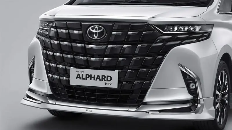 Close-up of a Toyota Alphard HEV car's front grille with chrome accents