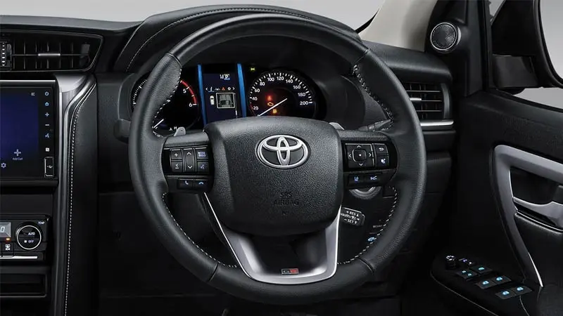 A close-up of the steering wheel of a Toyota Fortuner.