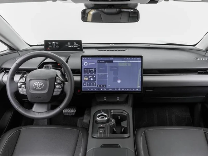 Interior of Toyota bZ5 electric SUV showing panoramic sunroof and ambient lighting - autoini